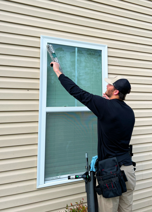 Julian washing a window